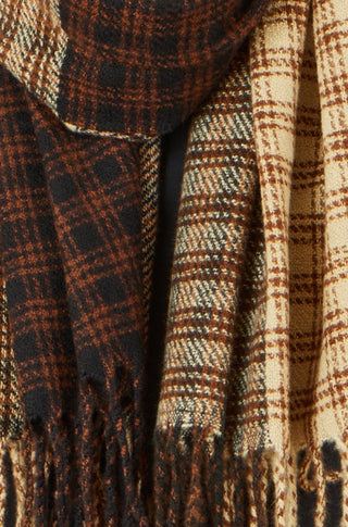 Close-up of plaid fabric with brown, black, and beige colors.