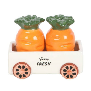 Pineapple-shaped salt and pepper shakers in a decorative cart with 'Farm Fresh' text.