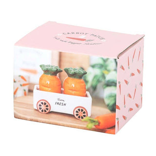 Pink packaging box with cartoon carrots and a cart on a white background