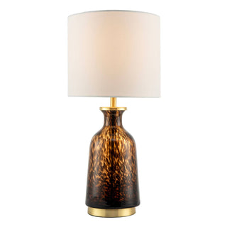 Table lamp with a tortoiseshell-patterned base and white shade on a white background