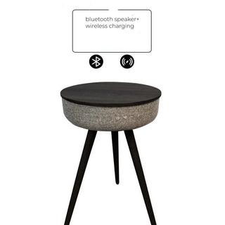 Round side table with Bluetooth speaker and wireless charging capabilities on a white background