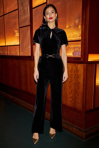 Yumi Black Velvet Jumpsuit With Twist Neckline And Buckle Belt