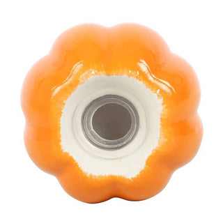 Orange and white ceramic knob on a white background