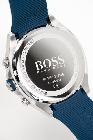 Close-up of a BOSS smartwatch with blue strap and silver case on a white background