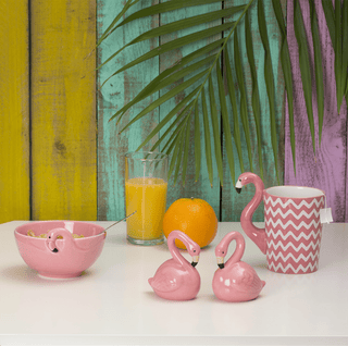 Pink mug with flamingo design and chevron pattern on a white background